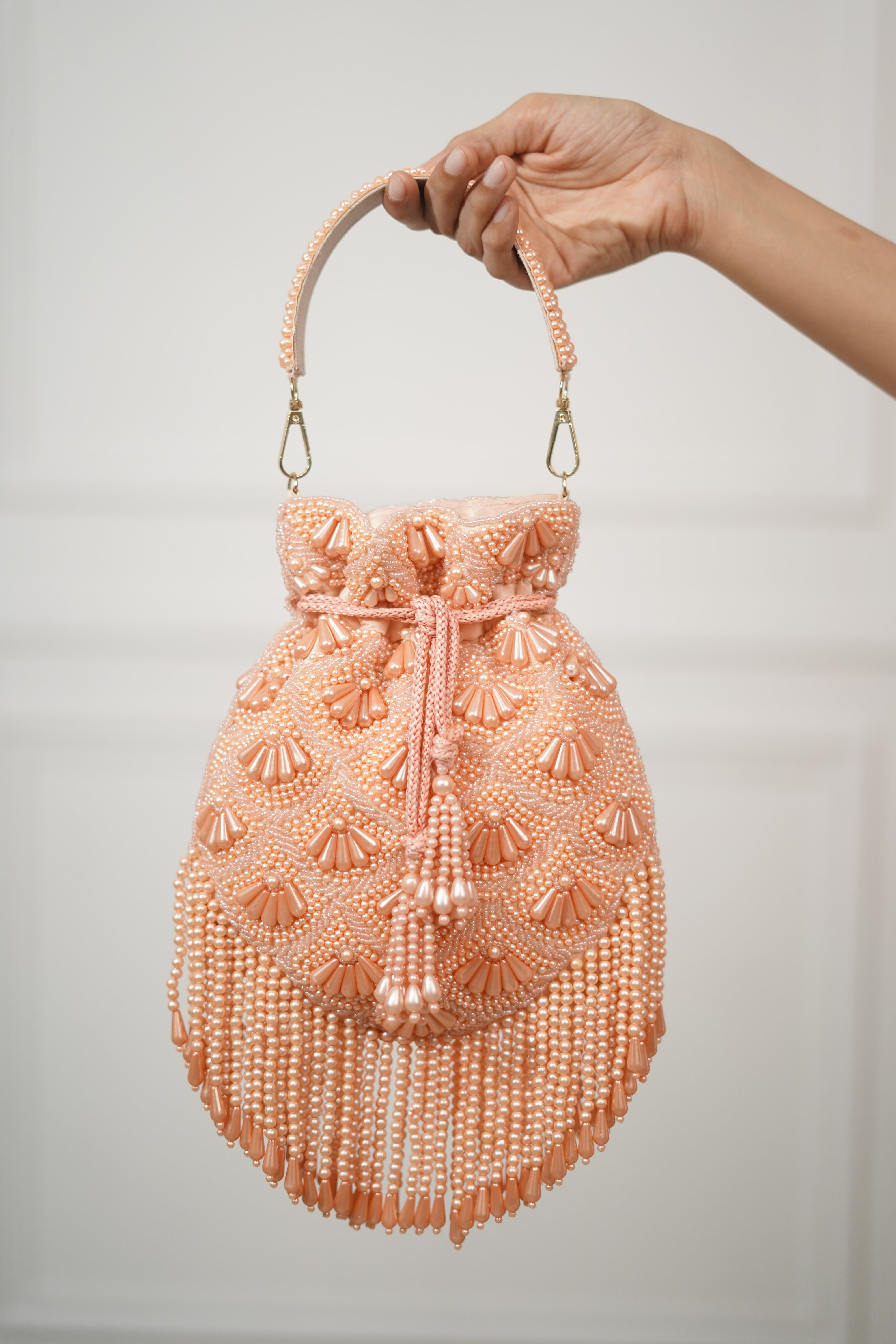 Gulnaar Peach Pearl Embellished Potli