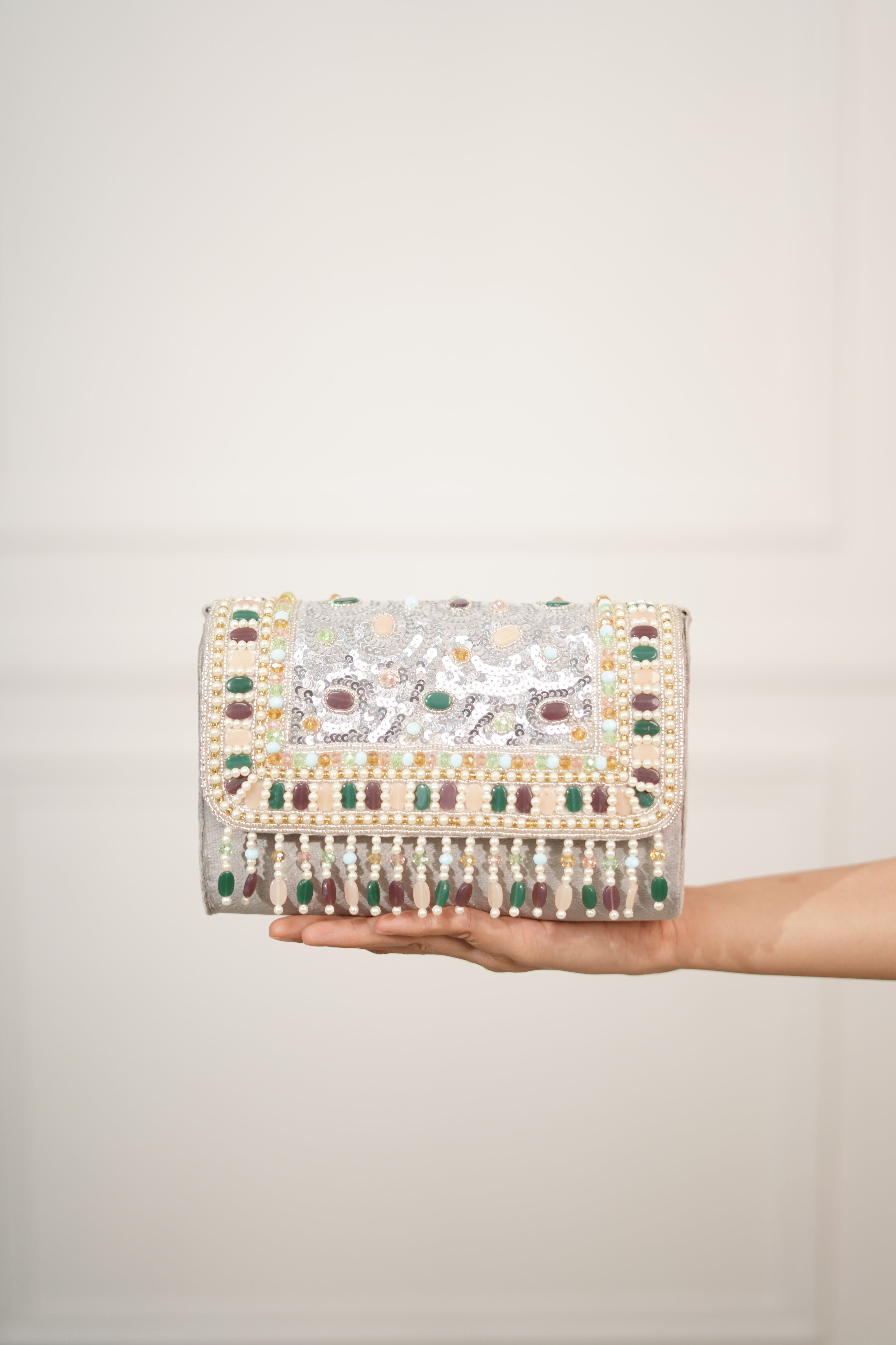 Mahira Stone and Sequin Flap Clutch with Tassels